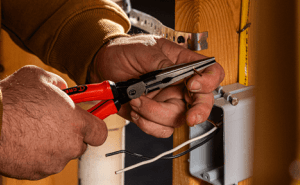 Electrician using a Crescent 8" Z2 long nose plier to bend electrical wire