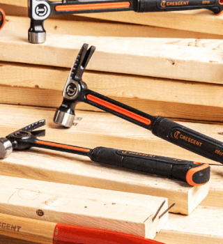 Crescent family of hammers sitting on plywood and lumber