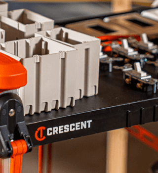 Close up of the top shelf of a Crescent SITERUNNER loaded with VDE tools and electrician products
