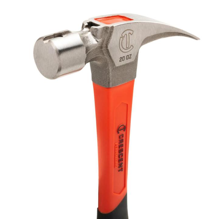 Close-up of a Crescent 20 oz. claw hammerâ€™s steel head and orange handle on white, with â€œ20 OZâ€ visible.