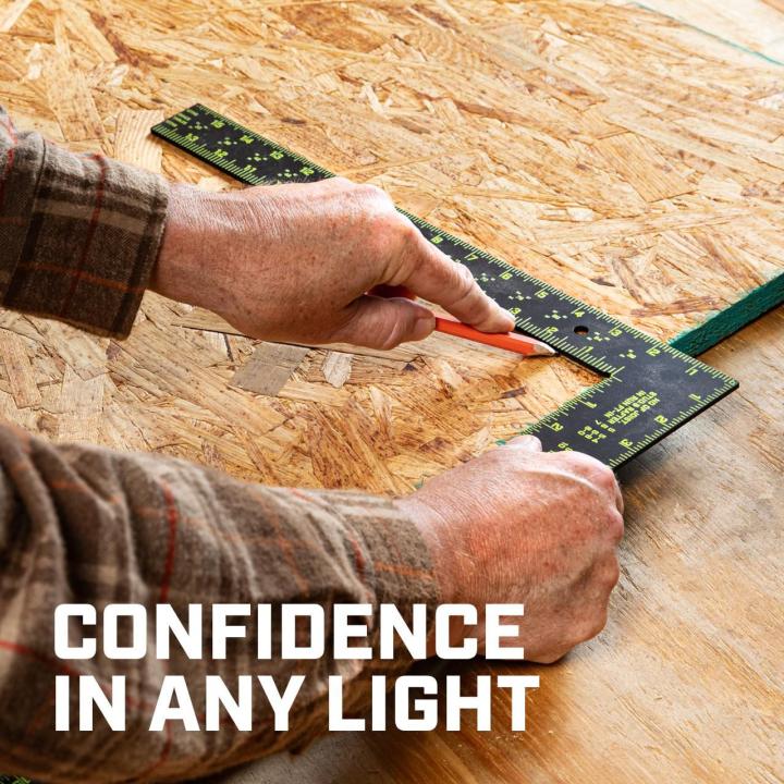 CFS1624 16 x 24 NITE EYE™ framing square being used to mark wood, demonstrating confidence and visibility in varied lighting.
