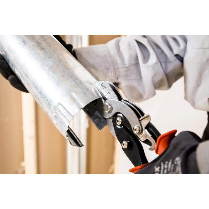 Image of a person using the CH5SC on duct piping.