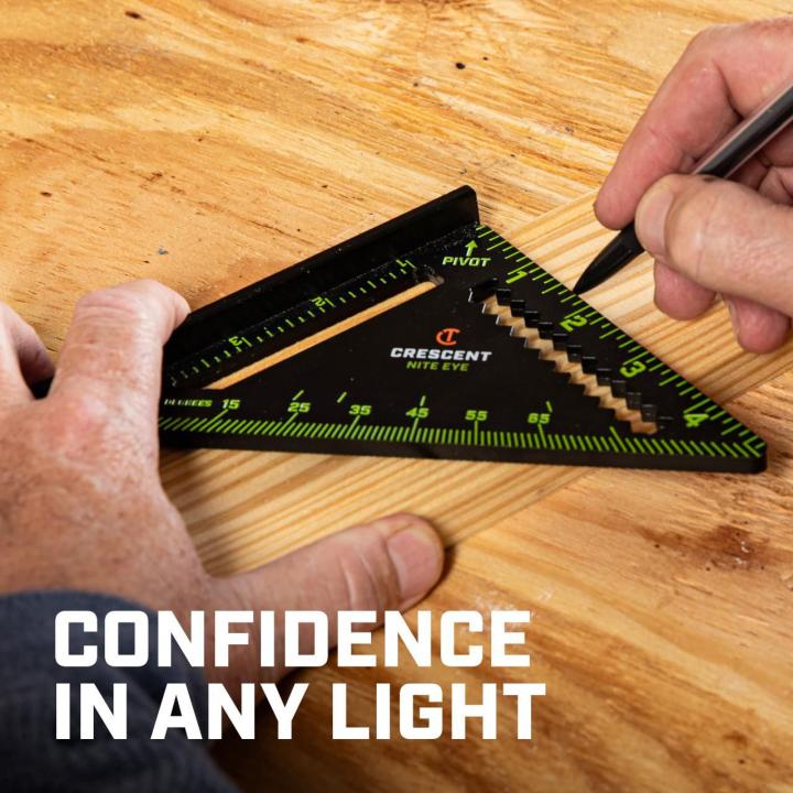 CTS04 4.5-inch NITE EYE™ trim square being used to mark a wood board, demonstrating confidence and visibility in varied lighting.