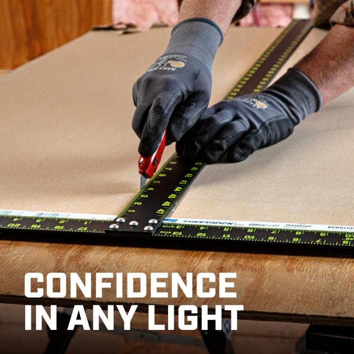 CTS48 48-inch NITE EYE™ T-square being used with gloves to cut sheet material, demonstrating confidence and visibility in varied lighting.