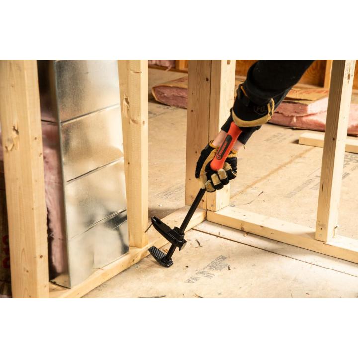 Image of the Crescent 24" adjustable pry bar showing a person using it on a construction site