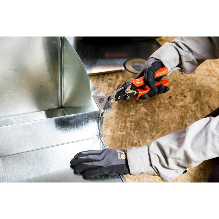 Gloved worker uses a Crescent WS3N hand seamer to bend sheet metal beside ductwork on a jobsite.