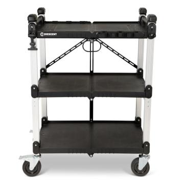 Front view of a black-and-white Crescent SITERUNNER collapsible utility cart with three shelves, four casters, raised corner handles, and diagonal rear braces. Crescent logo on top shelf; white background.