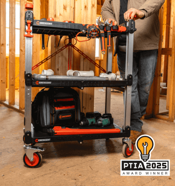 Man pushing a Crescent SITERUNNER folding cart in a residential construction environment with 2025 PTIA Award Winner logo in bottom right corner