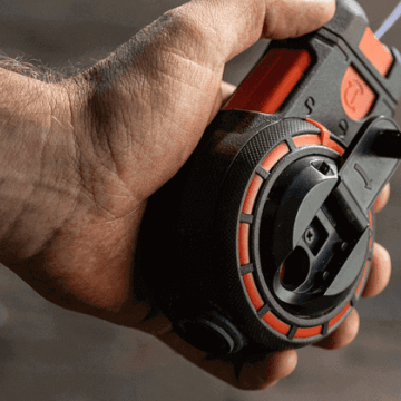 Male construction working using a Crescent Lufkin chalk reel to mark layout lines