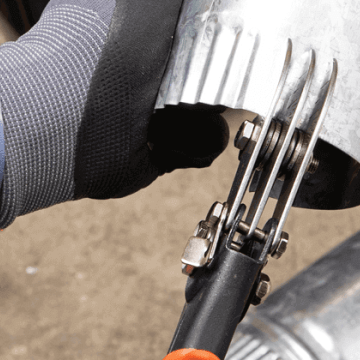 Male HVAC tech using the Crescent 3 blade crimper