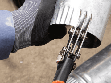 Male HVAC tech using the Crescent 3 blade crimper